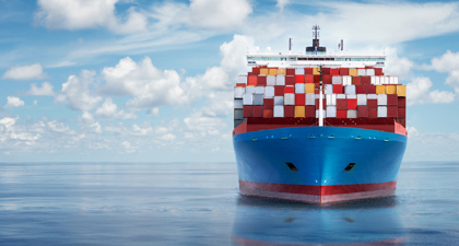 Container Ship Carrying Multi Coloured Containers At Sea