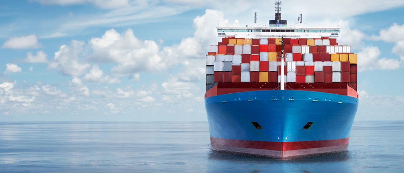 Container Ship Carrying Multi Coloured Containers At Sea