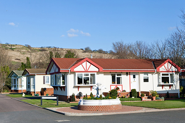 Row Of 3 Static Homes Hilly Backdrop