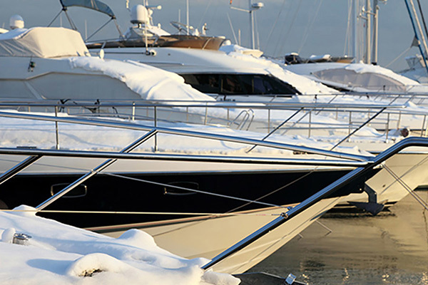 Row Of Luxury Yachts On Frozen Water