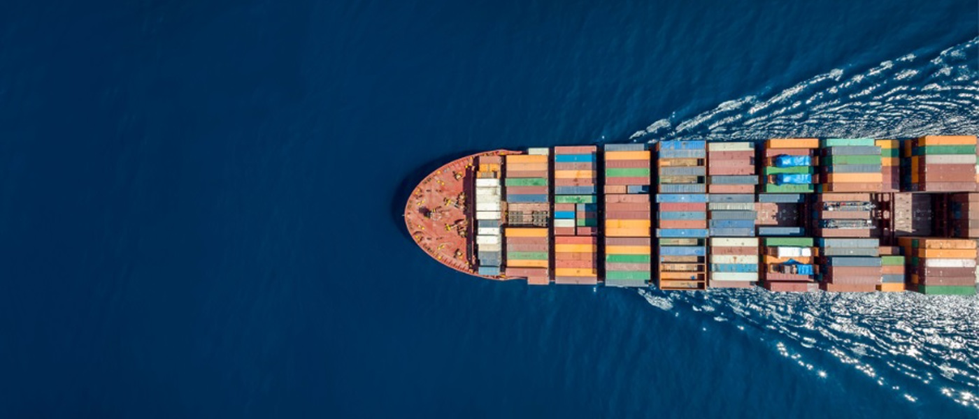 Aerial view of cargo liner on a blue sea