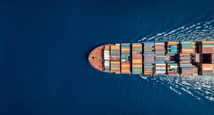 Aerial view of cargo liner on a blue sea
