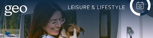 Banner Leisure And Lifestyle Women Holding Jack Russel Dog Out Side A Caravan