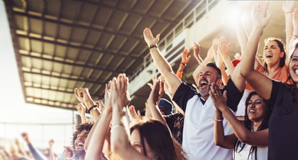 Supporters cheering in a sports stand