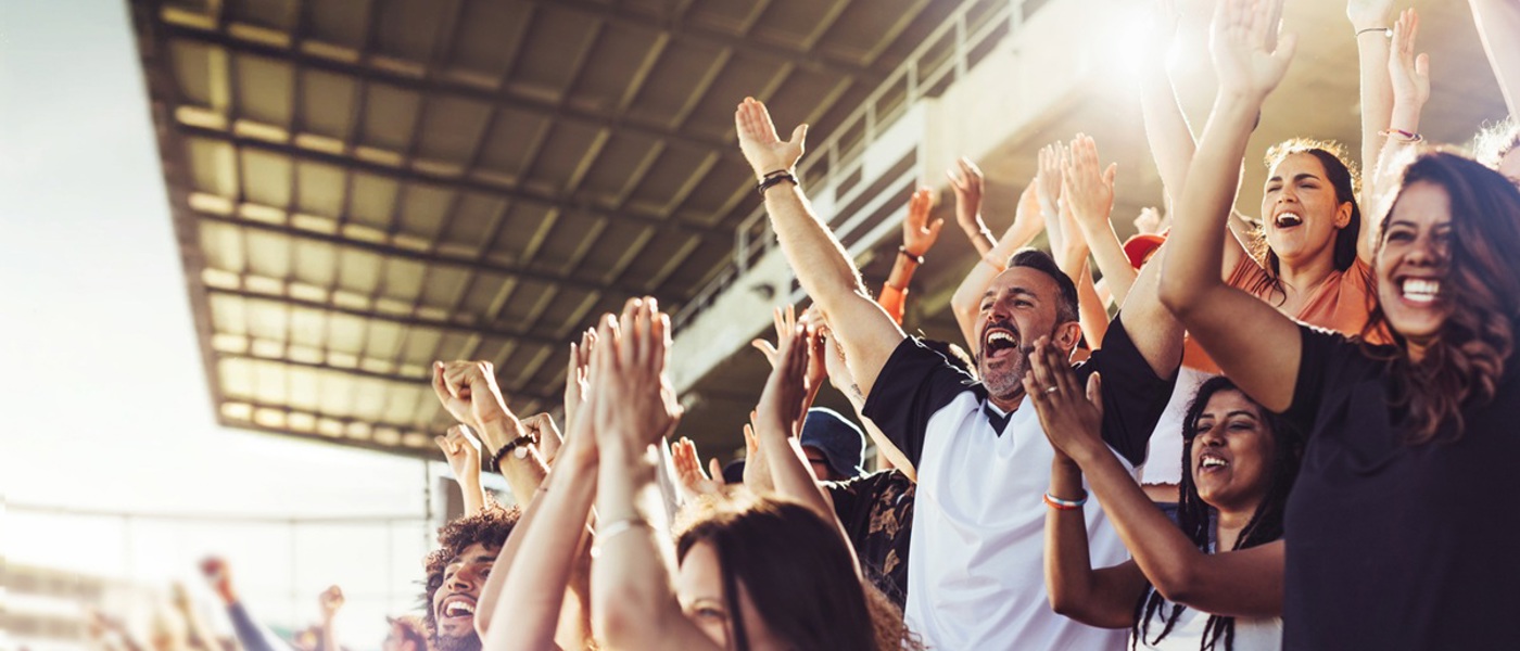 Supporters cheering in a sports stand