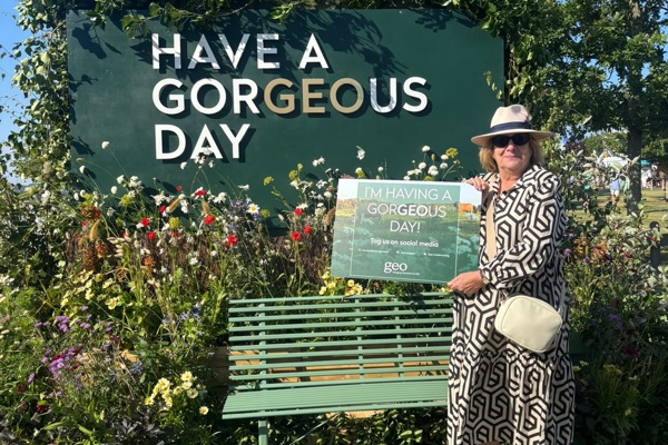 A member of the public with the Geo flower wall at The Great Yorkshire Show