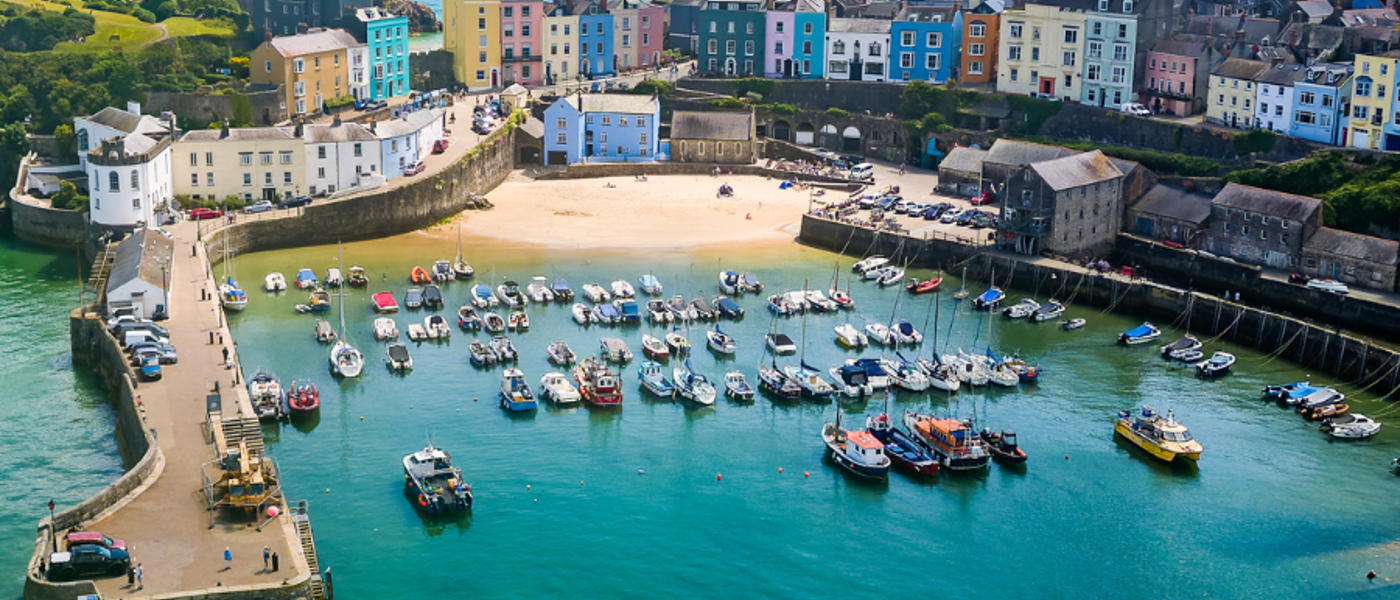 Aerial view of a harbour town with boats on the water