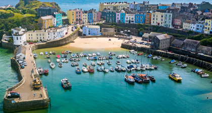 Aerial view of a harbour town with boats on the water