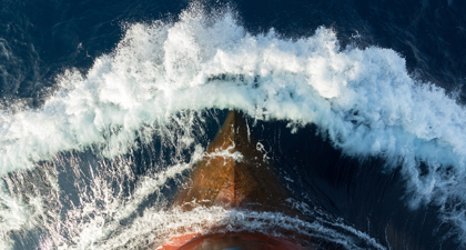 Top Down View Of Bow Of Large Ship At Sea