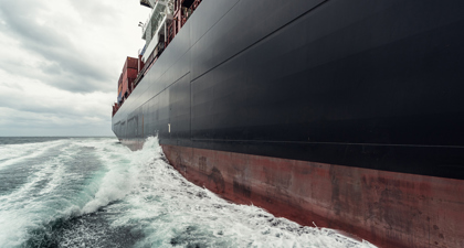 Side Of Cargo Ship At Sea