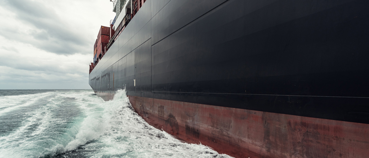 Side Of Cargo Ship At Sea