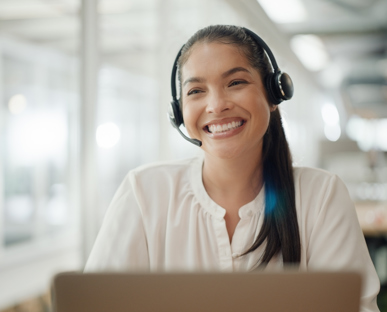 Call agent smiling whilst helping customers