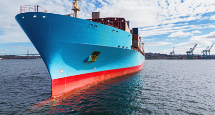 Blue Hull Of Large Cargo Ship At Sea