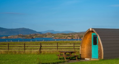 Glamping pod beside a lake
