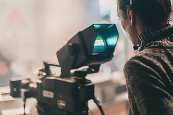 woman behind a camera