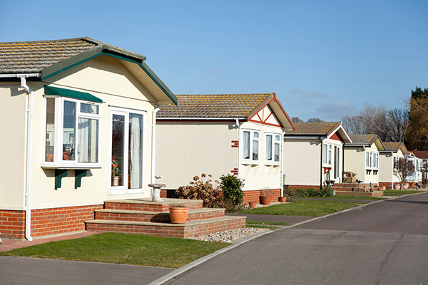 Row Of Six Static Homes On A Gentle Curve